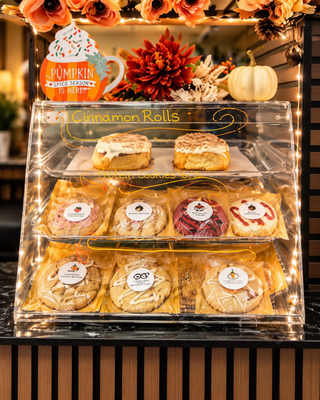 Pastry case with cinnamon rolls and cookies
